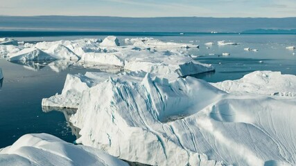 Wall Mural - global warming aerial drone video timelapse hyperlapse - greenland iceberg landscape of ilulissat ic