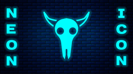 Poster - Glowing neon Buffalo skull icon isolated on brick wall background. Vector Illustration.