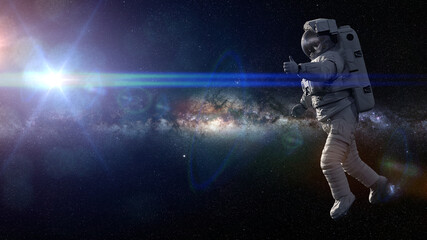 Wall Mural - astronaut showing thumbs up during spacewalk