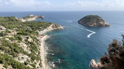 Wall Mural - Panoramic view of Cala Barraca beach and Portitxol Island in Javea, Spain