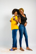 © Courage - young black beautiful ladies jubilating over something they received on their smartphones