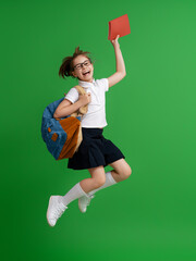 Wall Mural - Kid with backpack on color background.