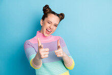 Hey You. Photo Of Attractive Crazy Funky Lady Two Buns Directing Fingers On Camera Blinking Eye Flirty Person Pick Select Wear Casual Warm Striped Sweater Isolated Blue Color Background