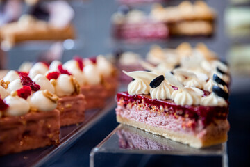 Exhibition of works haute sweet cuisine from pastry chef, chocolate cakes with fresh fruits and berries