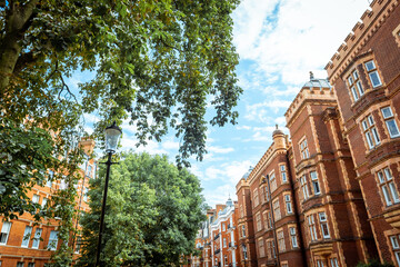 Wall Mural - Beautiful street of red brick residential property in Kensington, London 