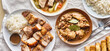 filipino dinner with sinigang, lechon kawali, and chicken adobo top down composition