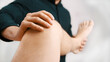 © CameraCraft - Young man having his knee examined by specialist. Physiotherapy knee flexibility. High quality photo