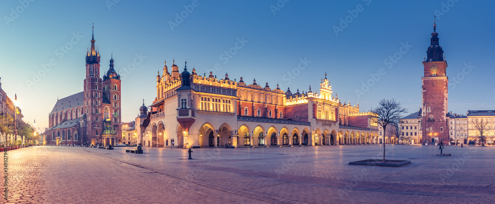 Krakow, Poland, main square night panorama with Cloth Hall and St Mary's church - obrazy, fototapety, plakaty 