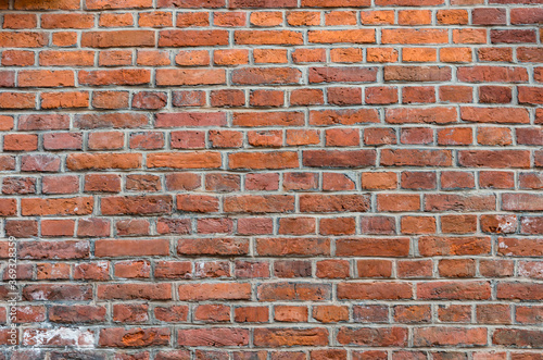 Photo Weathered red brick wall background, texture