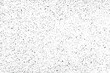 Grunge natural texture of the surface of the hardboard. Monochrome mottled background of chaotic particles, small fibers, specks, noise and grain. Overlay template. Vector illustration
