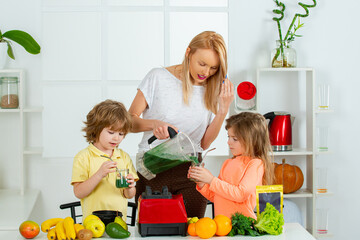 Wall Mural - Raw, vegan, vegetarian, alkaline food concept. Mother and children eating fruits and drinking smoothie, mothers day concept.