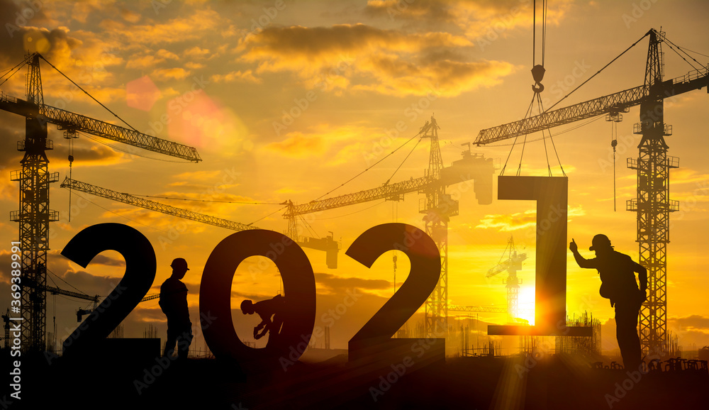 Silhouette construction site,Cranes building construction 2021 year sign - obrazy, fototapety, plakaty 