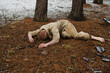 soldier lying in a winter forest world war II