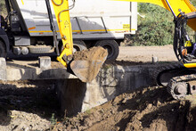 The Modern Excavator JCB Performs Excavation Work On The Construction Site