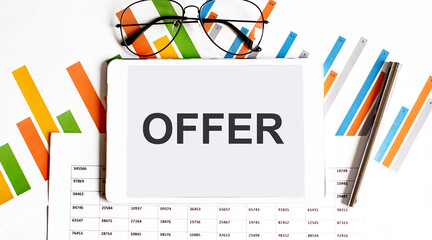 Poster - The tablet with text OFFER on business charts,glassis and pen