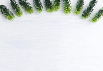 Christmas wooden background with snow fir tree.