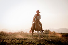 Full Length Of Man Horseback Riding Against Sky