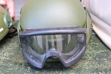 military green helmet with optical sight