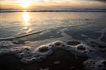 Tide foam in a nice blue beach in Morocco