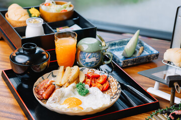 Food series: American breakfast set on wooden table in ryokan, traditional Japanese hotel