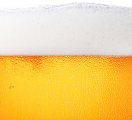 Close up background of beer with bubbles in glass