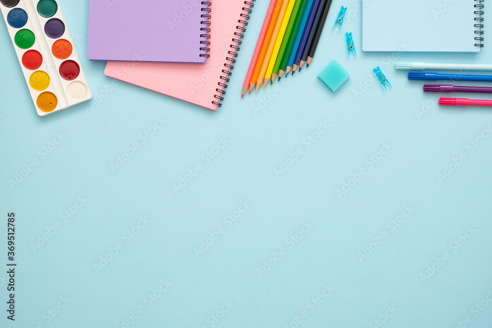 School Color Blue Education concept. Colorful stationery set on the blue background. Top ...
