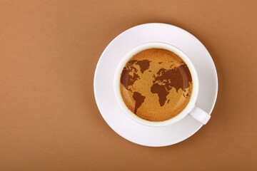 Wall Mural - Espresso coffee cup with world map on table