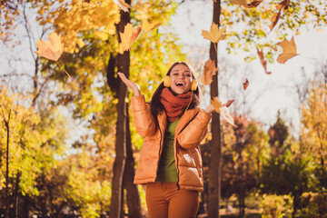 Canvas Print - Photo of pretty lovely lady beaming smiling throwing yellowed falling leaves stay among maples city park wear headphones scarf green turtleneck orange windbreaker pants outdoors