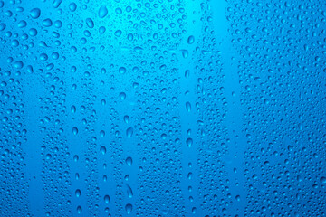 Close-up of water drops on glass . Abstract background texture.