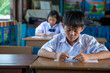 © visoot - Asian elementary students in uniform studying together at classroom,Education,Student,People concept.