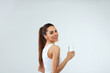 © verona_studio - Beautiful woman  holds water glass. Drink water. Girl with glass of water. Diet concept