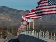 American Flags Line A Bridge In Rural Arizona