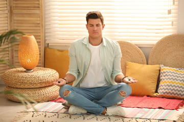 Wall Mural - Man during self-healing session in therapy room