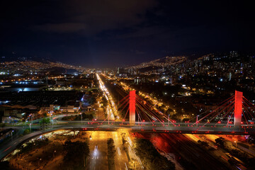 Wall Mural - Aerial shot of breathtaking cityscape with roads and modern buildings at night