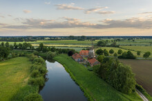 Aerial View Of The River And Old Windmill During Sunset