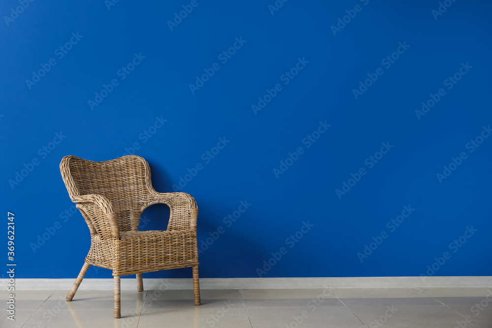 Comfortable armchair near wall in room