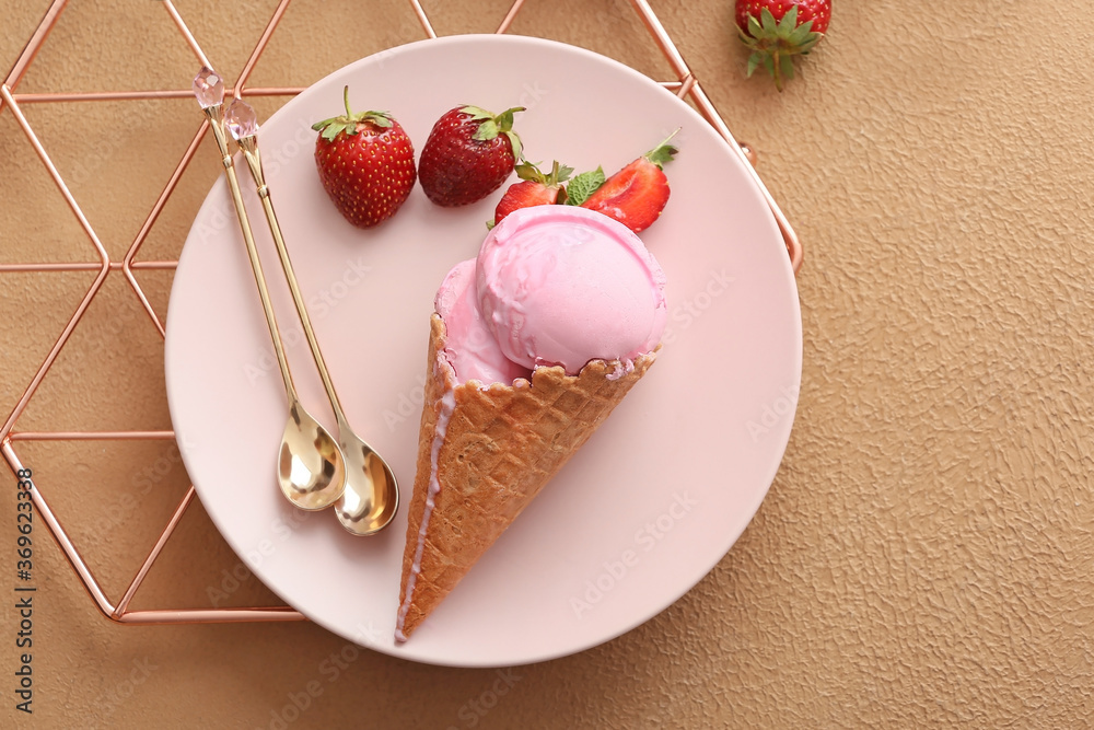 Plate with tasty strawberry ice cream on color background