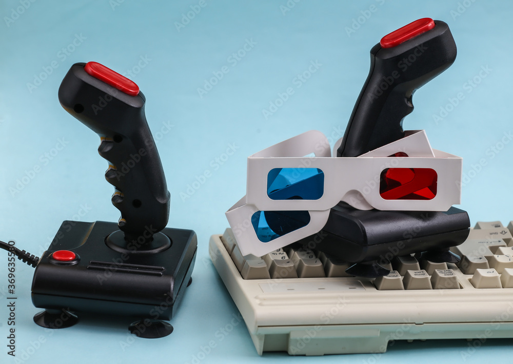 Retro joysticks with old pc keyboard and 3d glasses. Blue background ...