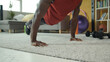 © Fractal Pictures - Strong african american athlete performing an elbow plank exercise and doing strengthening leg crunches stretching during home workout.