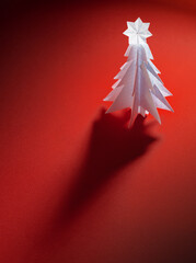 Wall Mural - Christmas trees made of paper on red background. Christmas card