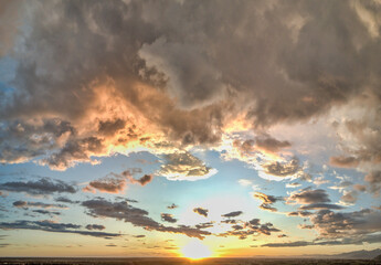 Wall Mural - amazing panoramic aerial view of sunset sky. beautiful clouds and colors at dusk