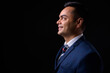 © Ranta Images - Portrait of happy young handsome Indian businessman in suit