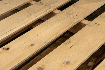 Wall Mural - Closeup shot of light brown wooden planks