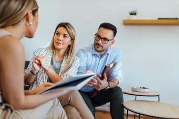 Wall Mural - Team of lawyers listening to a client, portrait.