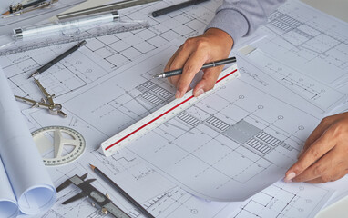 Architect engineer contractor design working drawing sketch plan blueprint and making architectural construction house building in architect studio.