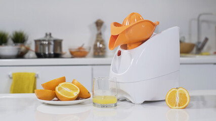 Mincer machine with citrus juicer in kitchen. White electric mincer machines for minced meat per minute, make sausages, mashed berries, squeeze juice and chop vegetables.