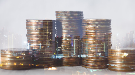 double exposure of city with row of coin stack for business investment finance banking and money saving concept.