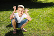 © Marina Andreichenko - Happy boy child is smiling and teasing. Portrait of young boy in nature, park, outdoor. Summer recreation with family