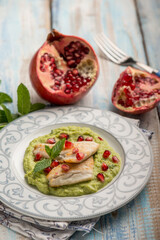 Canvas Print - fillet fish over green peas cream with pomegranate