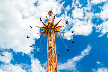 Kouvola, Finland - 14 July 2020: Ride Star Flyer in motion in amusement park Tykkimaki at summer sunny day